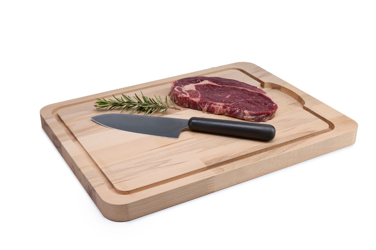 Large, thick beech wood cutting board with a juice groove and drain slot that keeps your counter clean when carving meat, poultry or juicy fruit. Solid oiled beech offers a stable, knife-friendly surface for professional and home kitchens. Size: 400 x 300 x 25 mm.