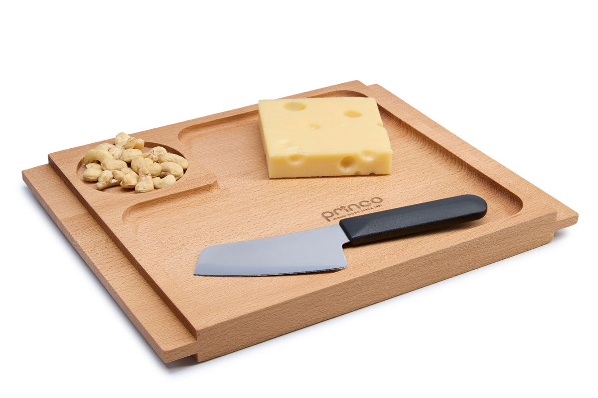 Solid beech wood serving tray with a cut-out and ergonomic side handles for easy carrying. Ideal for breakfast in bed, coffee, appetizers or cheese. Oiled beech ensures durability and a natural, warm finish. Size: 300 x 240 x 20 mm.