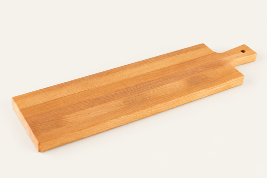 A rectangular wooden serving board with a handle and a small hole, shown on a clean off-white background.