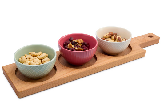 Long rectangular beech wood serving board with three cut-outs for sauces, olives or dips and a comfortable handle. Great for tapas, snacks and charcuterie at home or in restaurants. Solid oiled beech, durable and food-safe. Size: 470 x 125 x 15 mm.