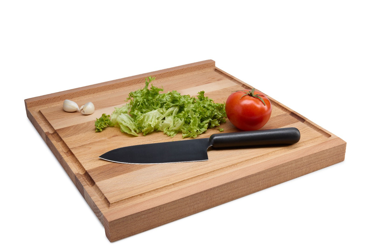 Square beech wood pastry board with two slats that hook onto the table edge to keep it steady while kneading and rolling dough. Ideal for bread, pasta, pastry and pizza. Solid oiled beech. Size: 350 x 350 x 19 mm.