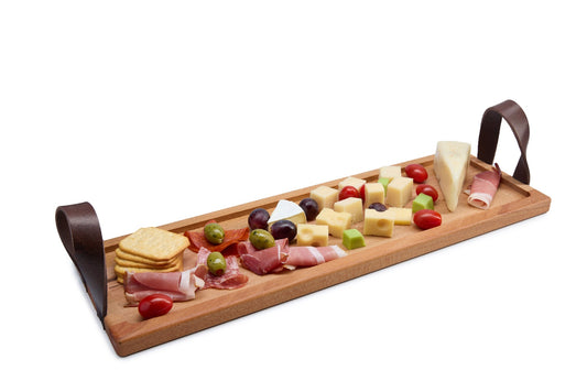 Long, narrow beech wood serving tray with leather handles and one large cut-out, perfect for bread, sushi, cheese or appetizers. Solid oiled beech with an elegant modern design. Size: 530 x 170 x 20 mm.